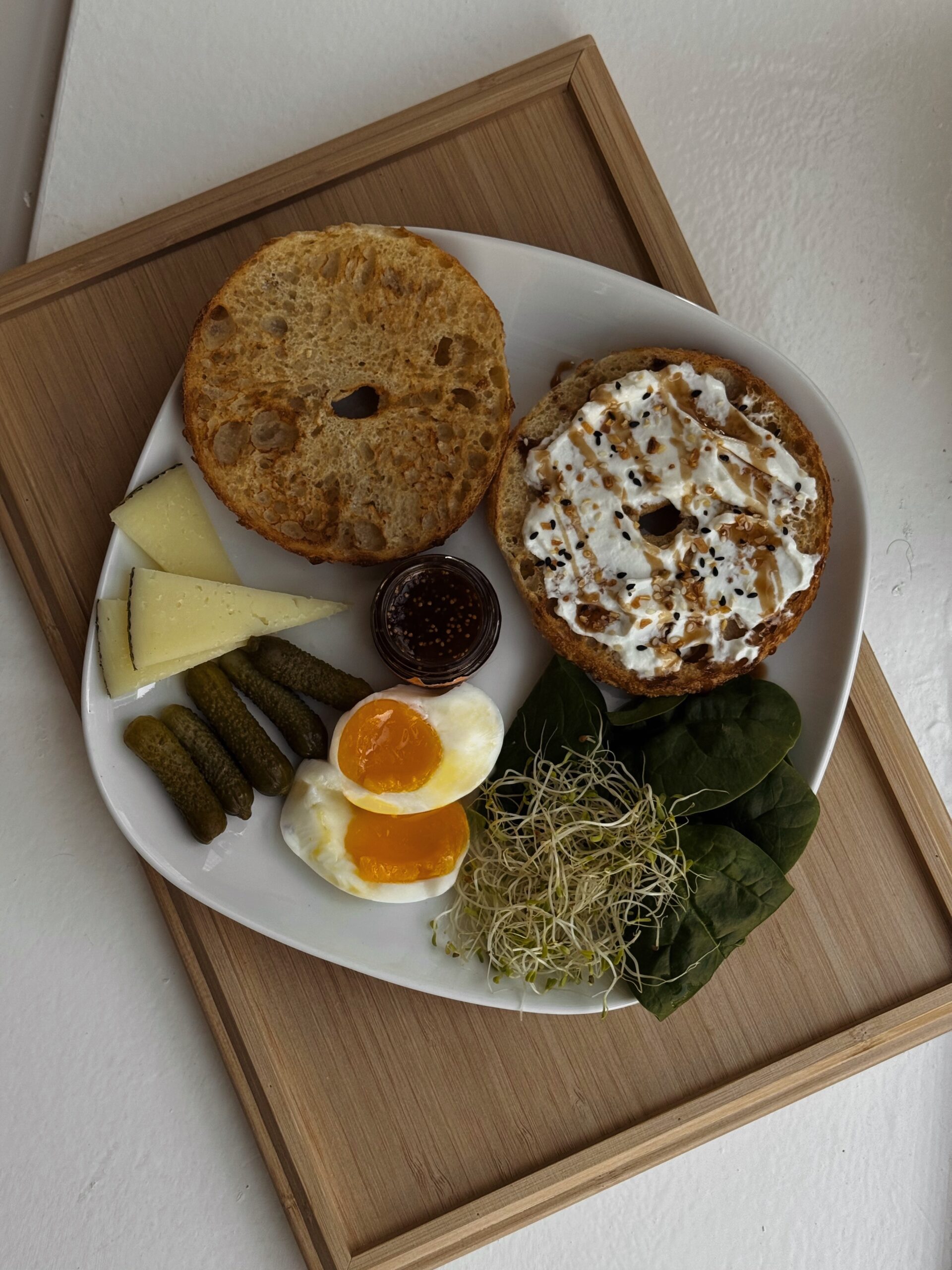 Toasted Sourdough Bagel with Cream Cheese, Egg, Cheese & Greens